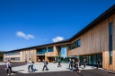 Students leaving school at Nore Neset Skole, Os, Norway designed by Ramboll.